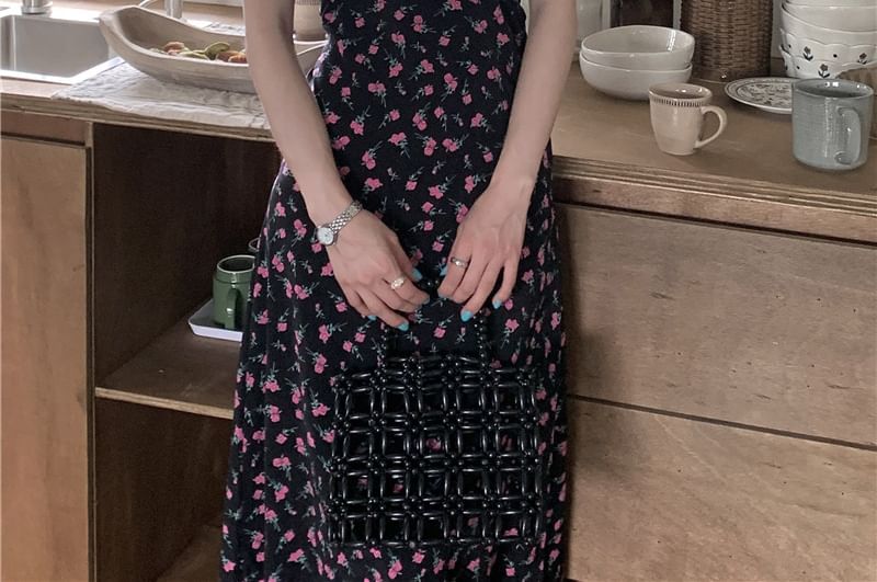 Brigitte - Mouwloze V-hals maxi-A-lijnjurk met bloemenprint en ruches