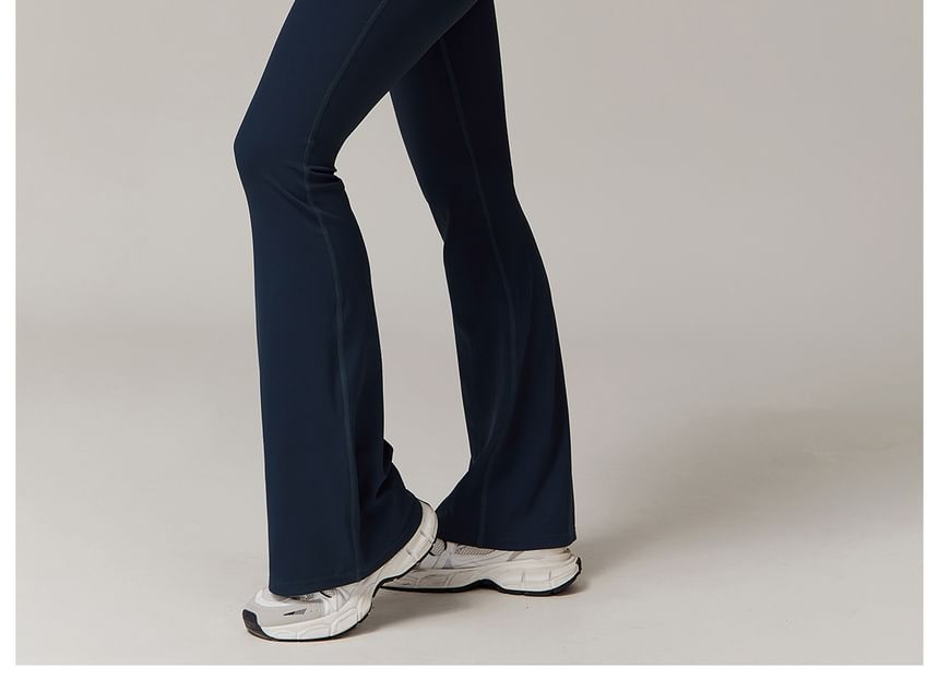 Skinniano - Spaghettibandjes, contrasterende afwerking en open rug, bootcut sportjumpsuit
