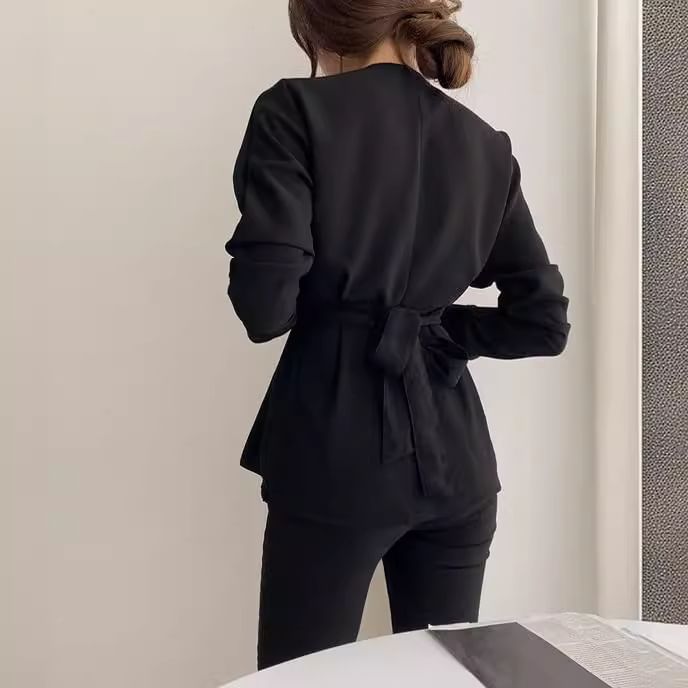 Sienne - Effen peplumblouse met V-hals
