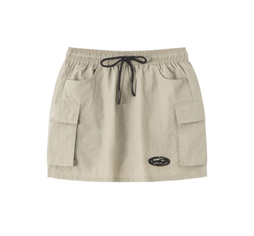 Nariele - Cropped jack met opstaande kraag en ritssluiting / Mini-kokerrok met trekkoordtaille