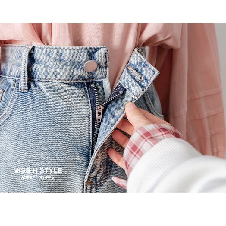 Cossita - Mini A-lijn rok van gewassen denim met hoge taille en volantrand