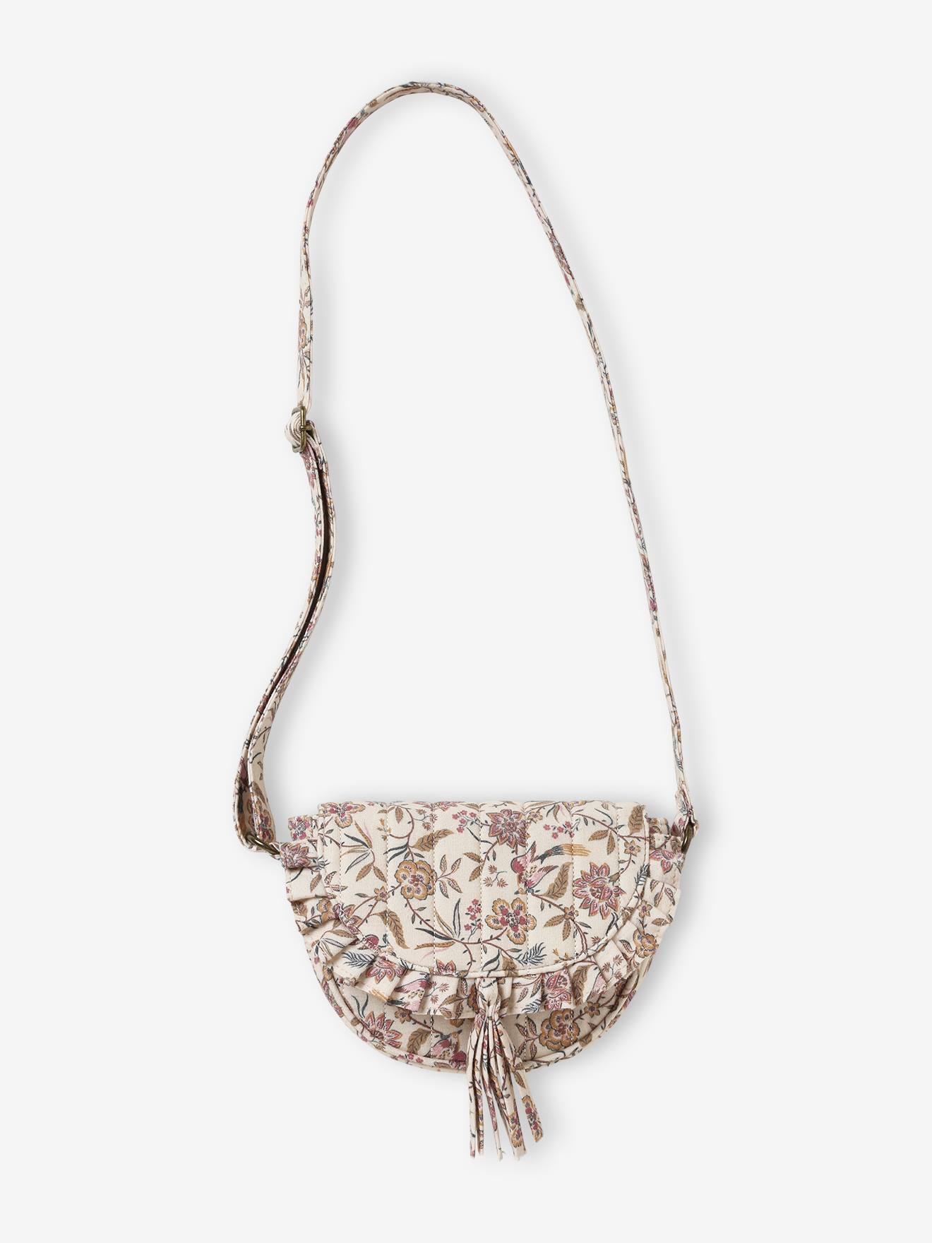 Bolsa feminina bege com estampa floral.