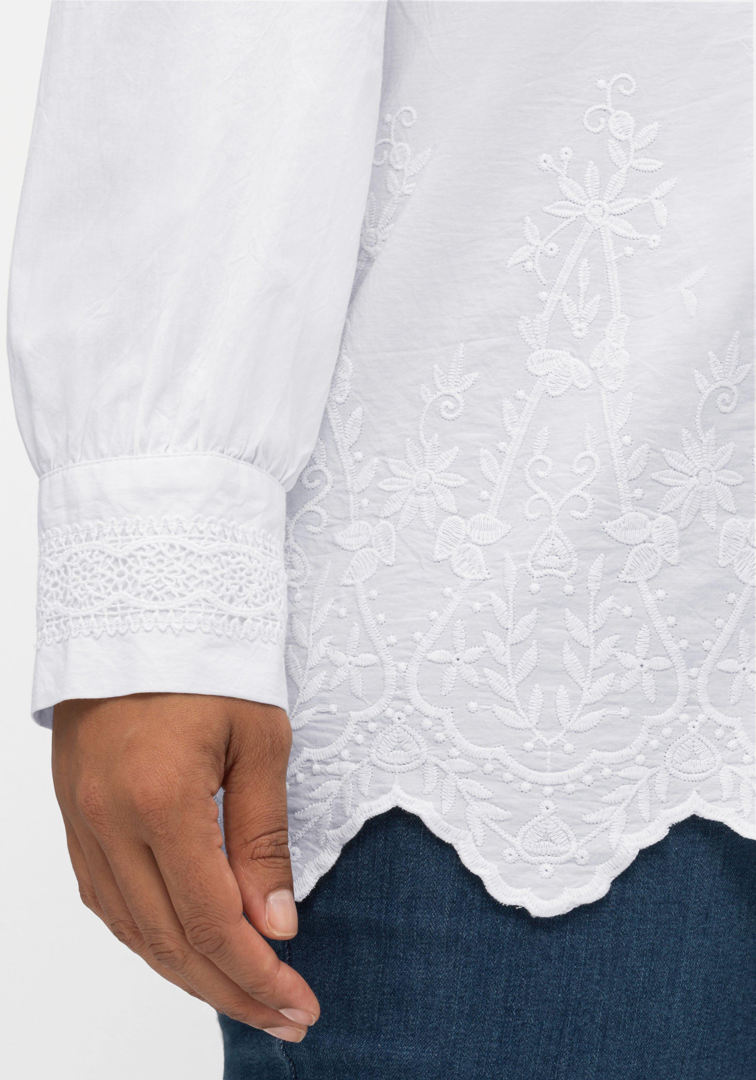 Bluse mit floralen Stickereien und Wellensaumkante