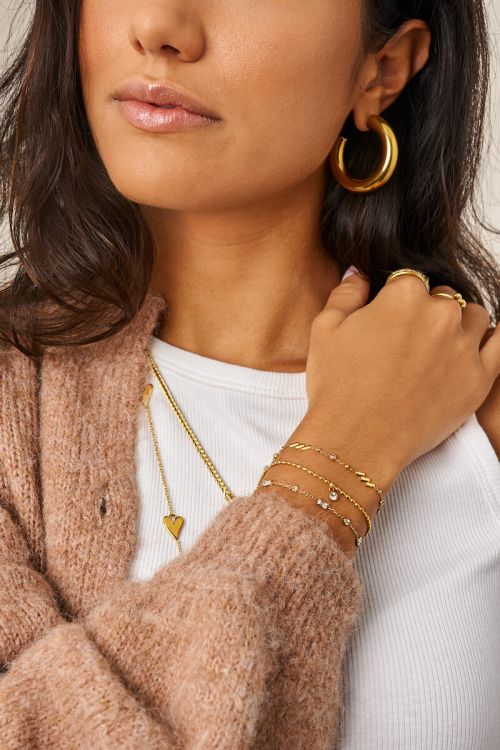Minimalistische armband met diagonale strepen en strass