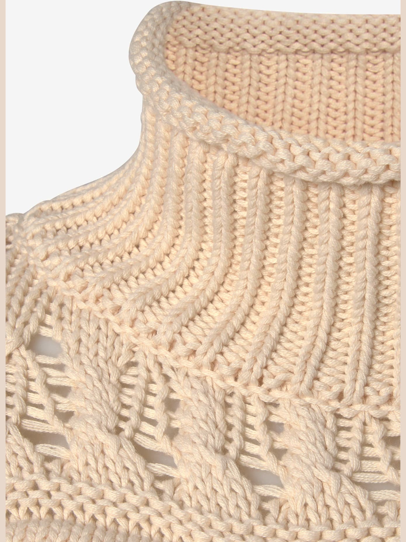 Pull col roulé en tricot ajouré