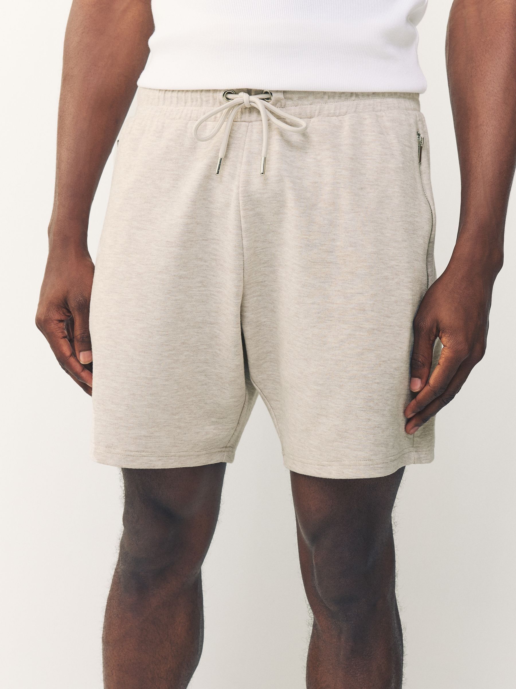 Gemêleerd naturel - Jersey shorts met ritszakje
