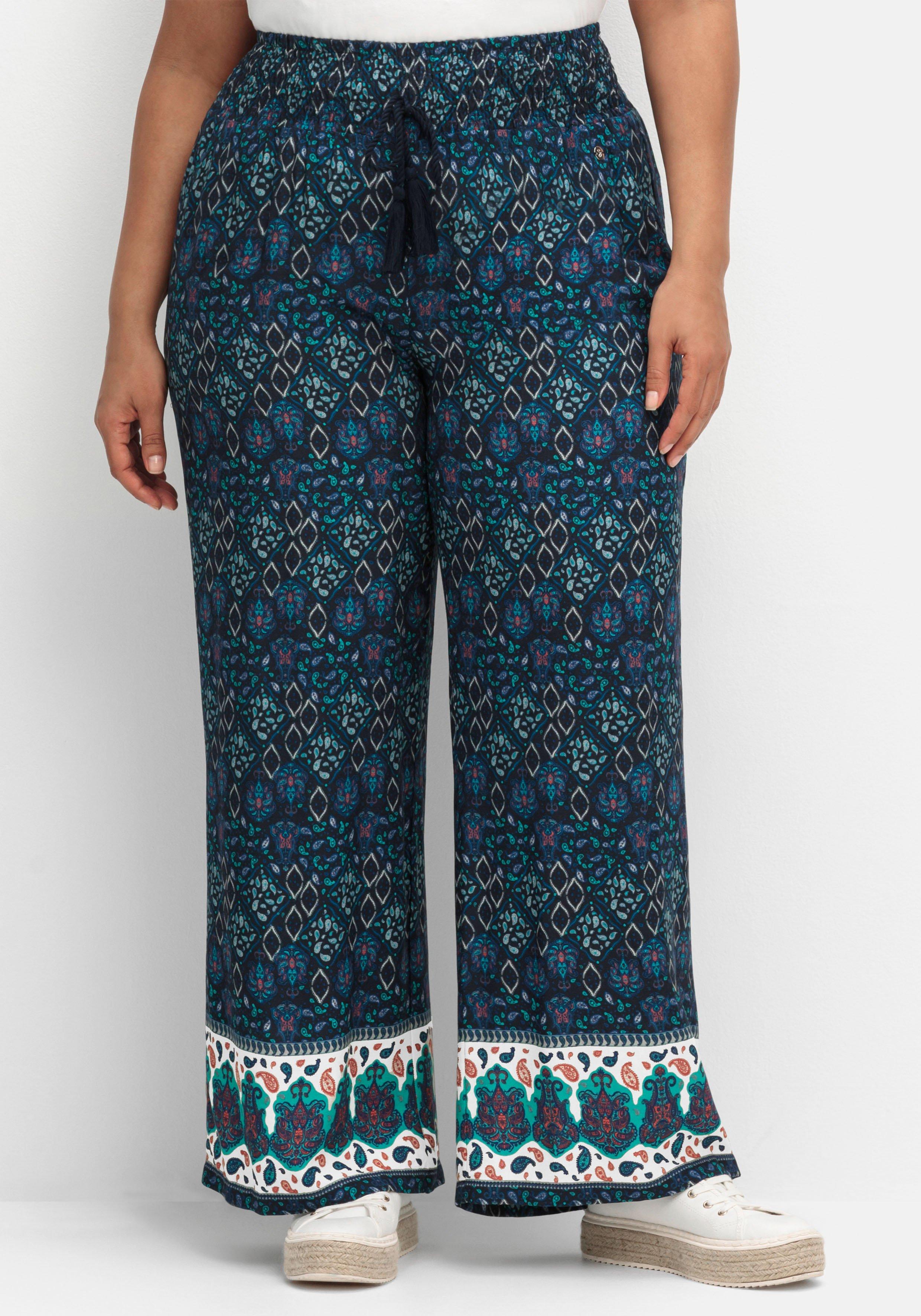 Weite Schlupfhose mit Alloverdruck und Smokbund