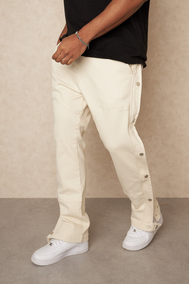 Jean beige à empiècement boutons sur les côtés