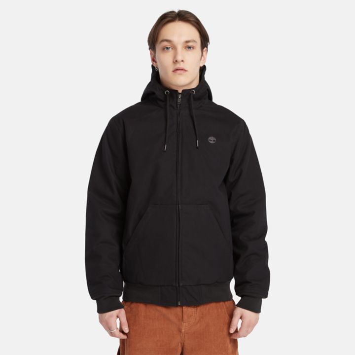 Jaqueta bomber masculina com capuz e isolamento térmico em lona preta.