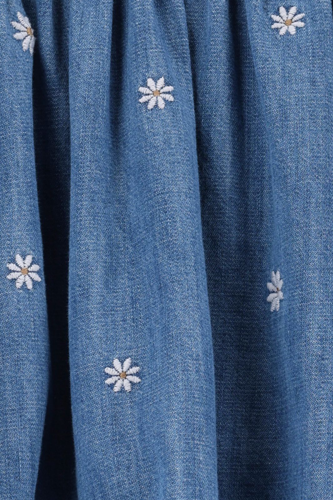 Blauwe rok met madeliefjes embroidery