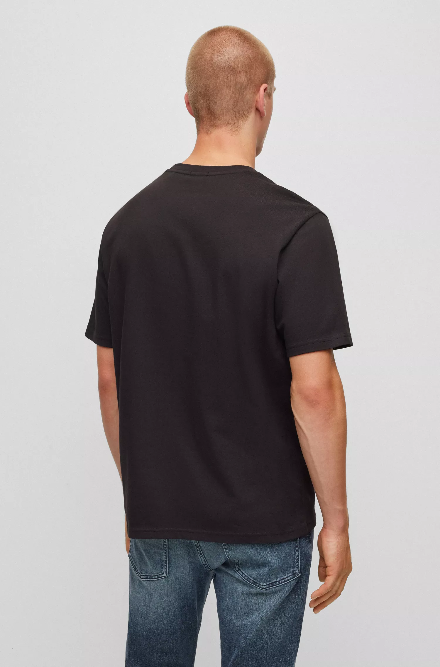 Camiseta BOSS laranja, modelagem relaxada, em malha de algodão com estampa sazonal.