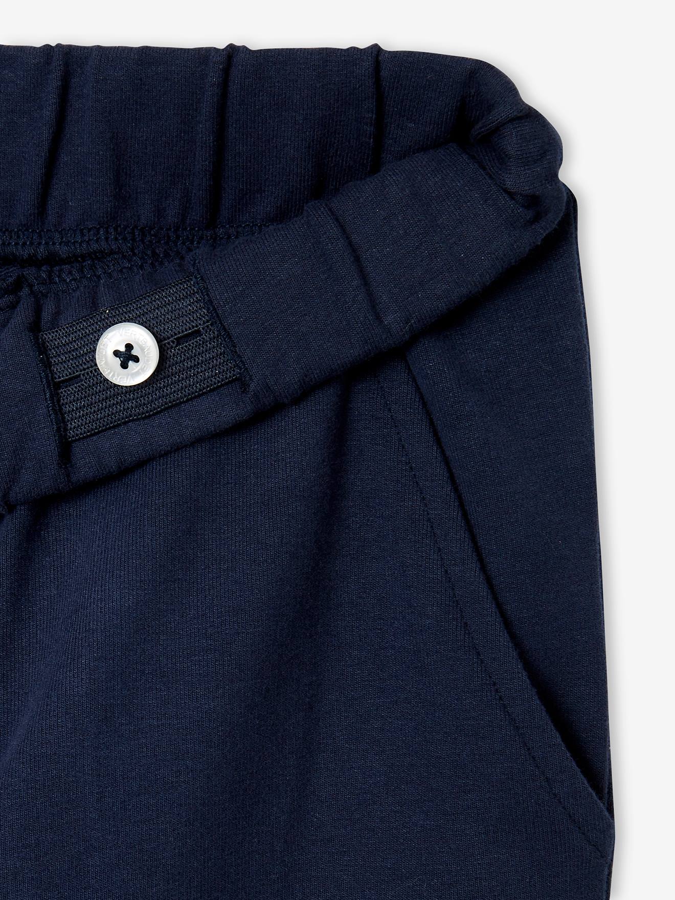 Calças de fato de treino lisas azul-escuras para meninos com estampas.