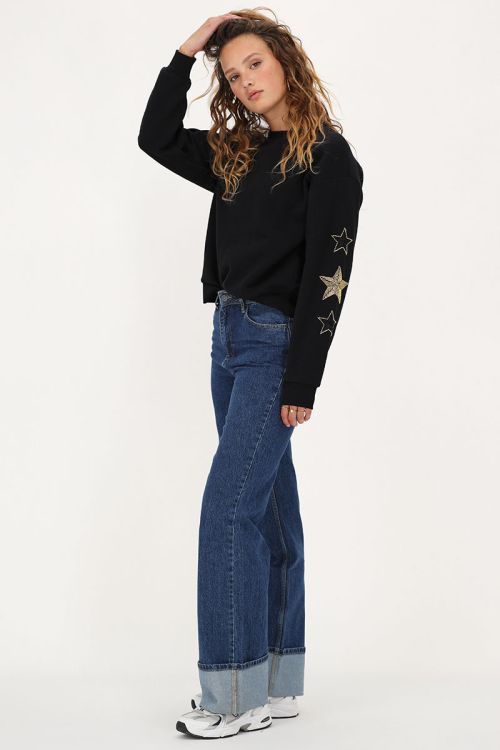 Zwarte sweater met goudkleurige sterren