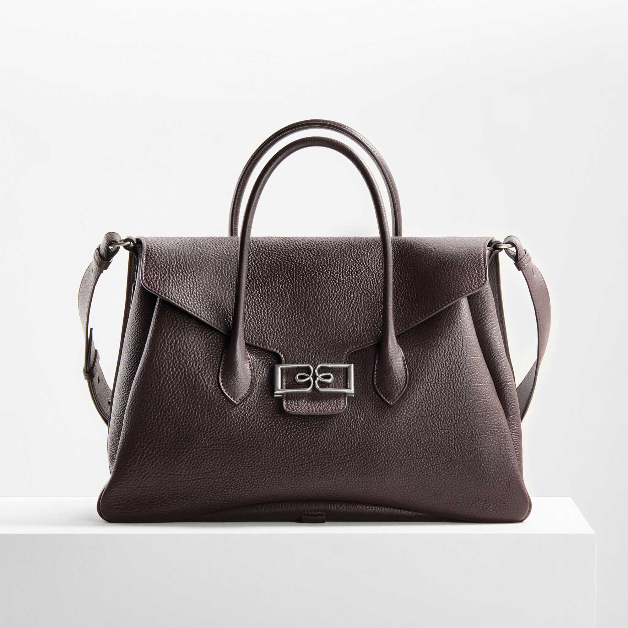 Sac De Voyage B Volute Croisee En Cuir