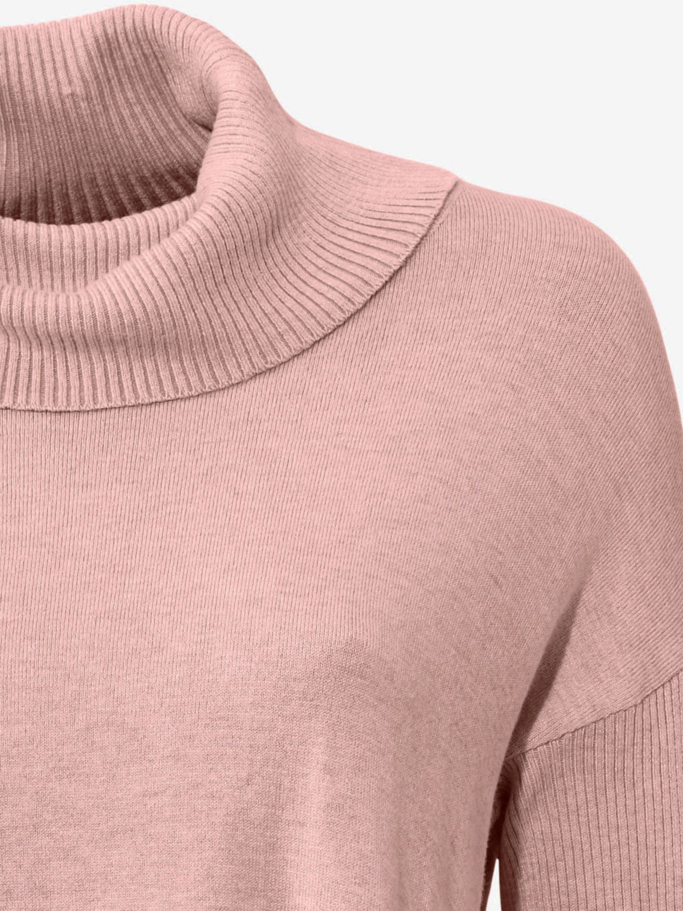 Pull col roulé style poncho tendance avec franges