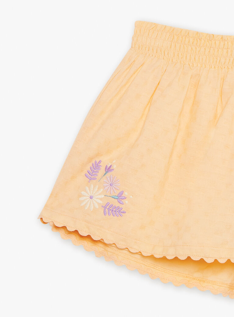 Short orange clémentine à broderies fleuries