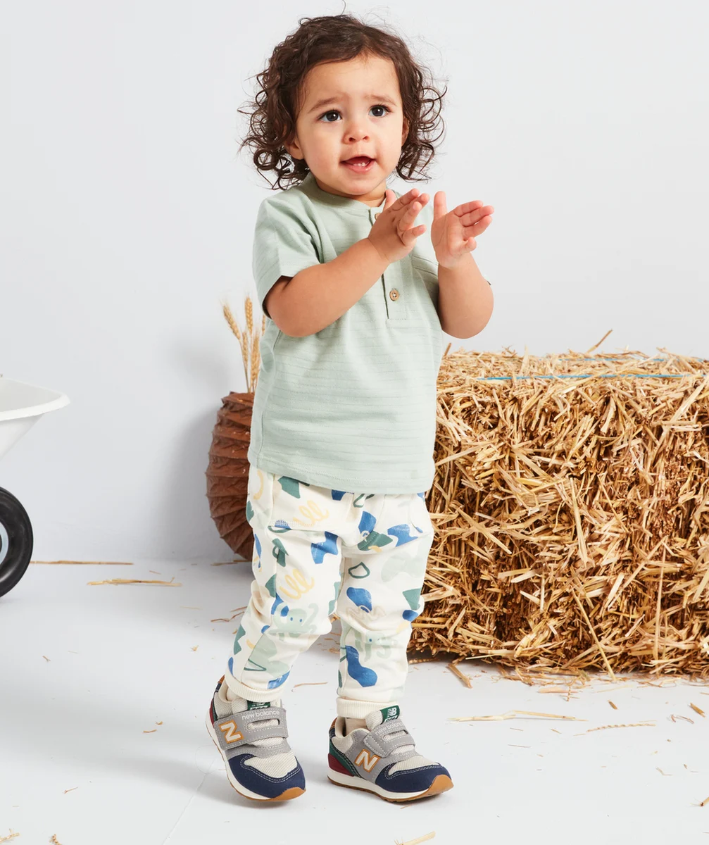 JOGGING BÉBÉ GARÇON ÉCRU AVEC POULPES ET FORMES COLORÉS