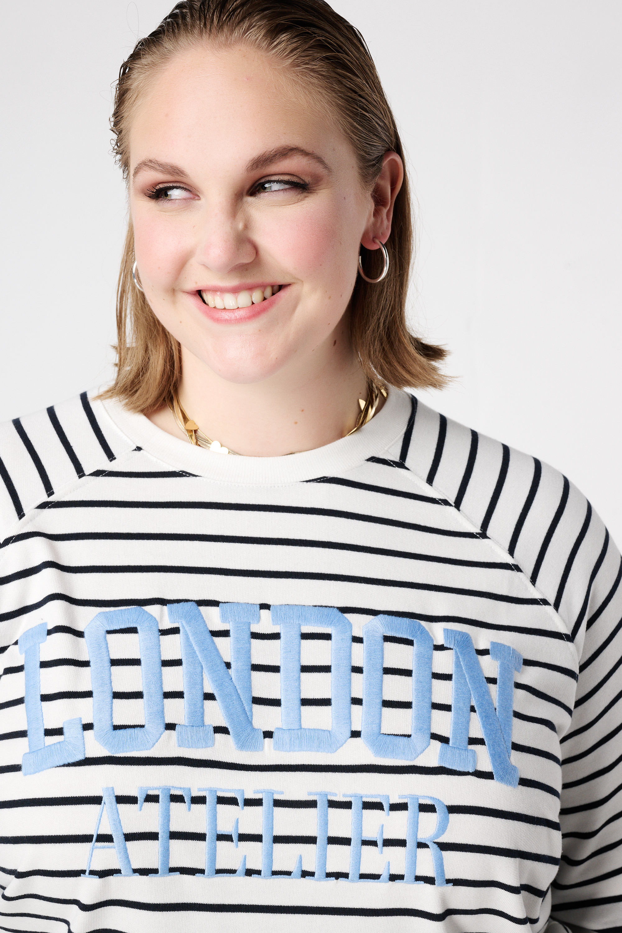 Gestreepte sweater met tekstprint Multi zwart-wit