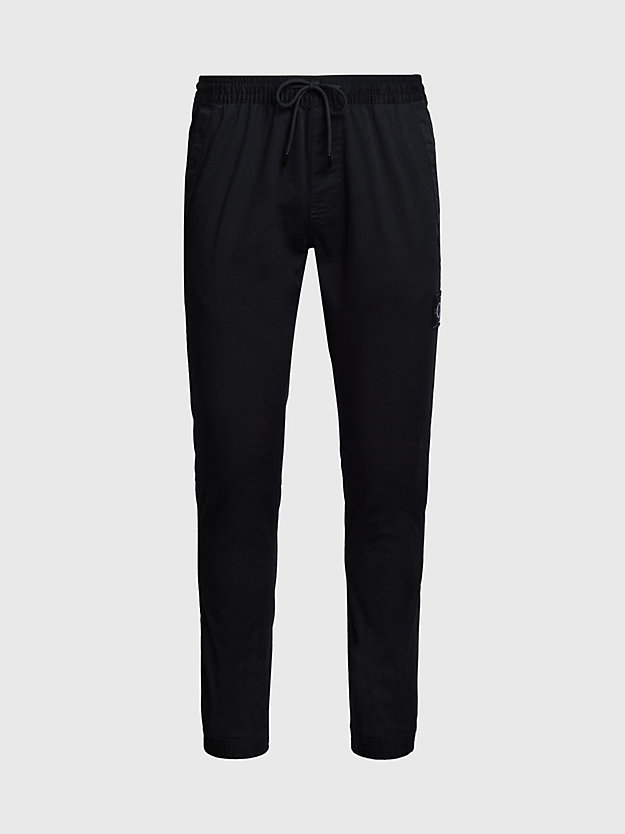 Calças chino skinny em sarja de algodão