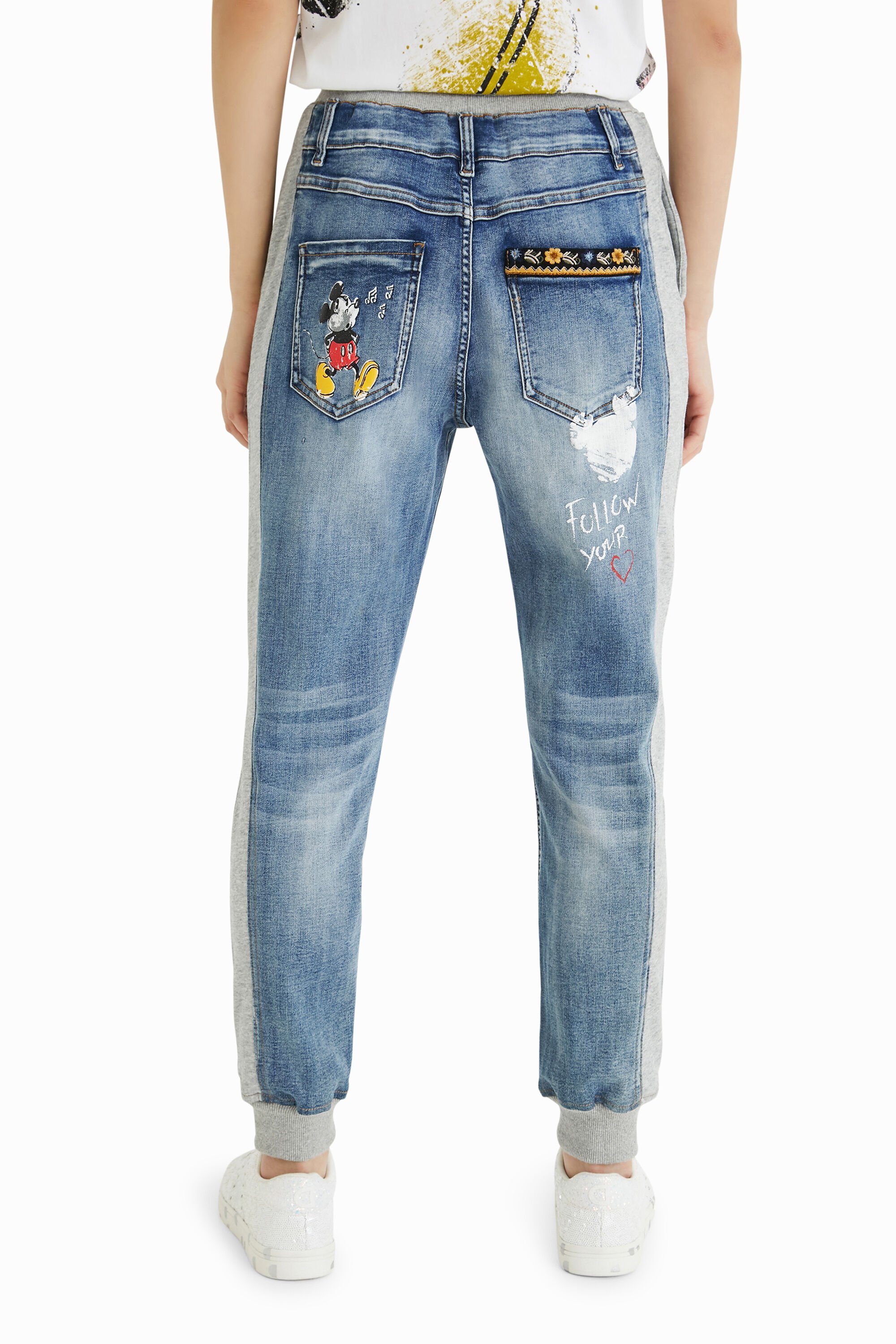 Jean jogging Mickey Mouse