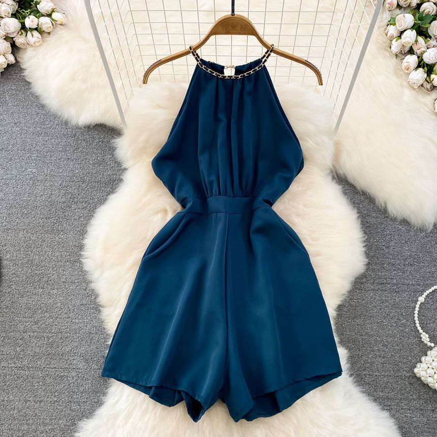Yearnin - Mouwloze halter romper met wijde pijpen