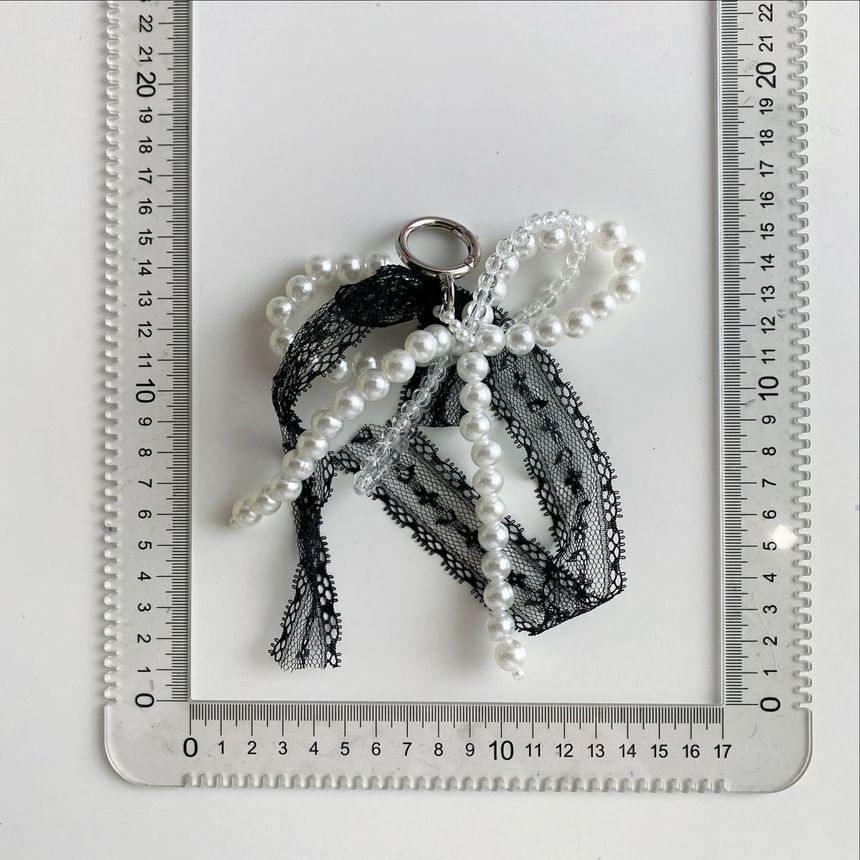 BeDaisy - Sleutelhanger met strik en imitatieparelkant