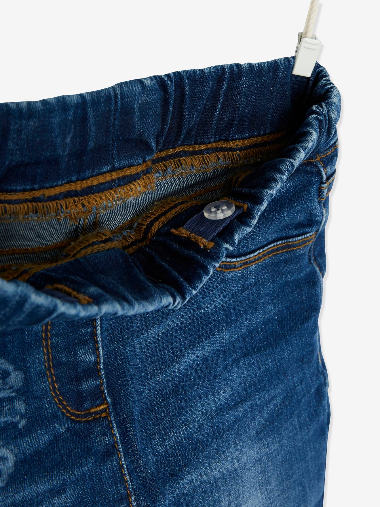 Calça legging infantil com estampa a laser, na cor azul médio lisa com detalhes.