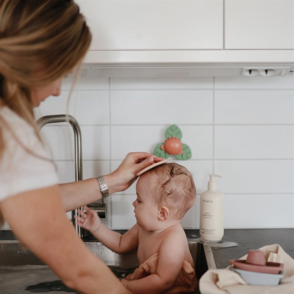 Køb Mushie Dino Suction Spinner Legetøj