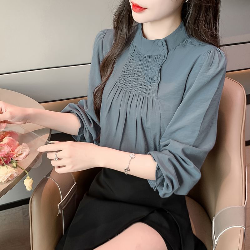Bornite - Blouse met lange mouwen en geplooide hals en smokwerk