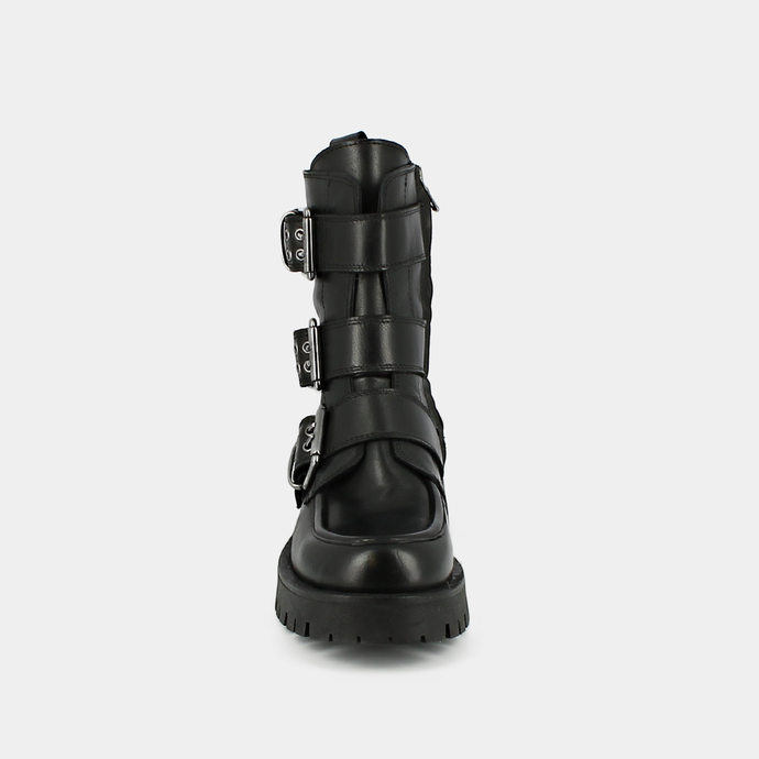 Boots à semelles crantées et sangles  en cuir noir