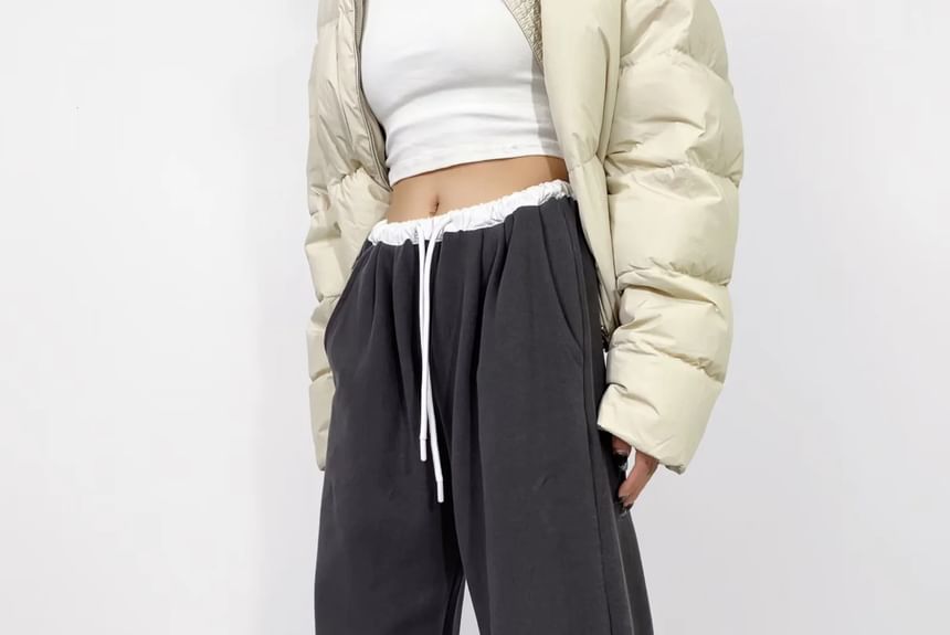 Asiris - Lage, contrasterende, losse joggingbroek met wijde pijpen
