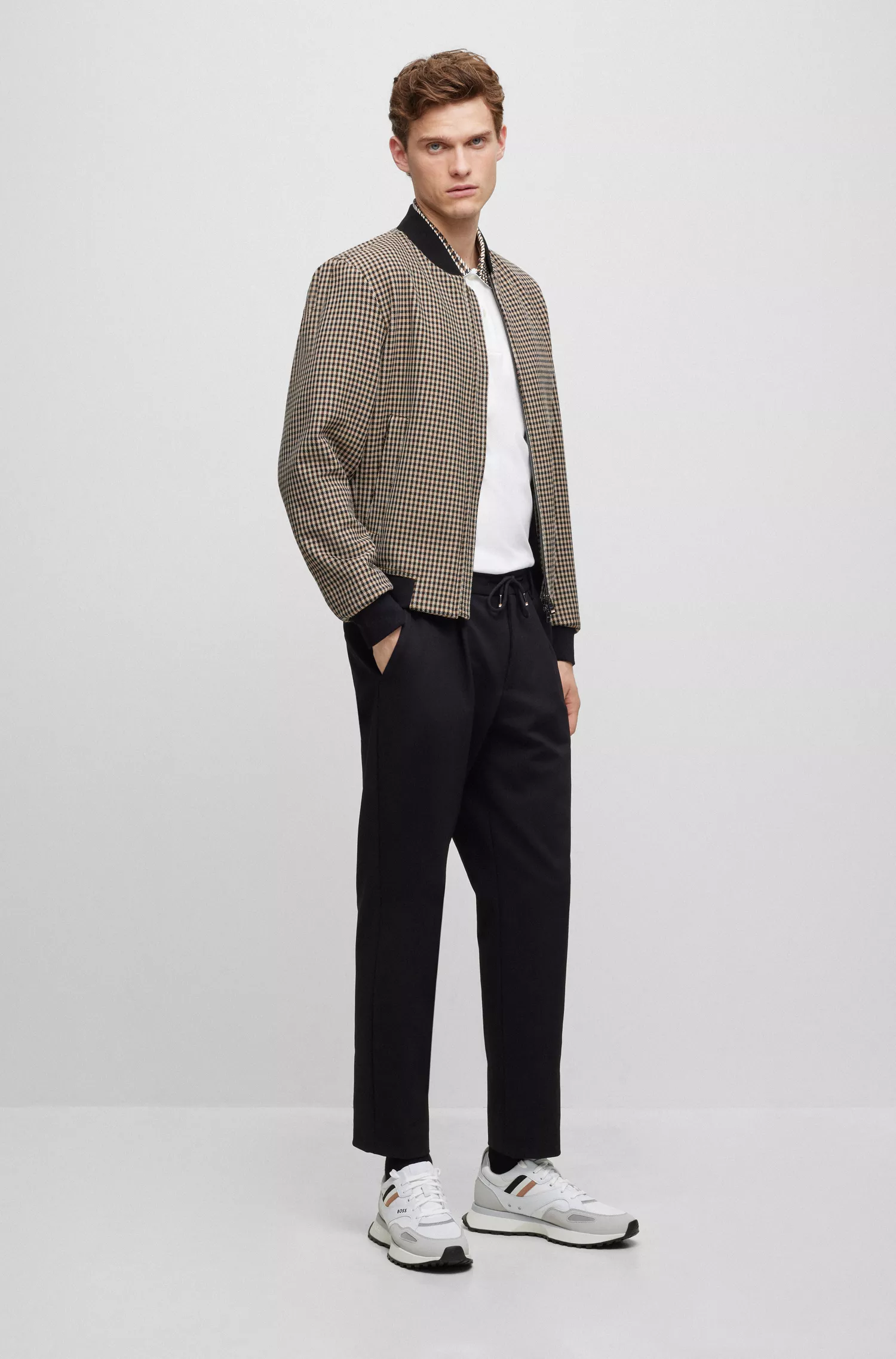 Camisa polo BOSS preta em algodão mercerizado com gola pied-de-poule.
