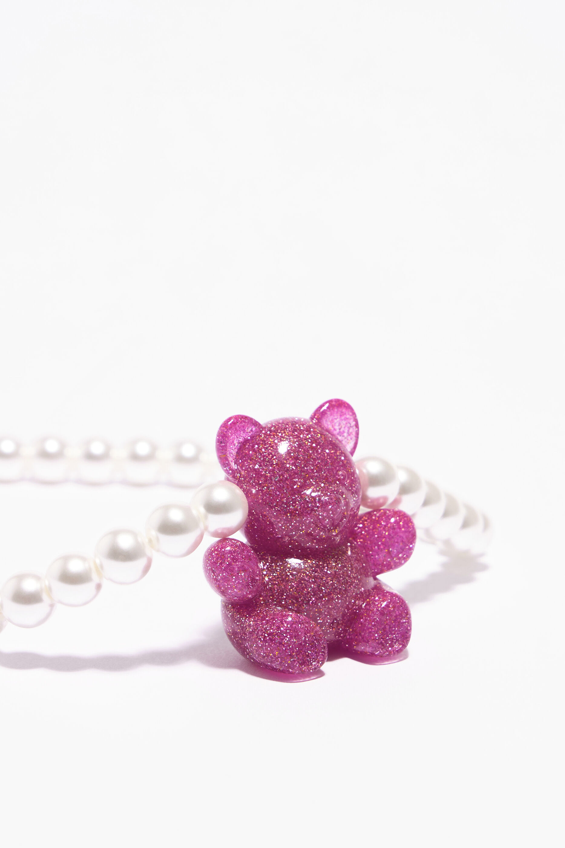 Colar de pérolas em forma de urso rosa