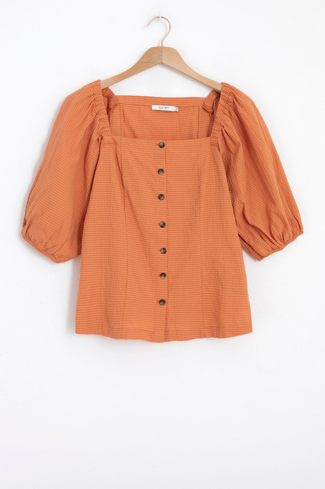 Oranje blouse met pofmouwen