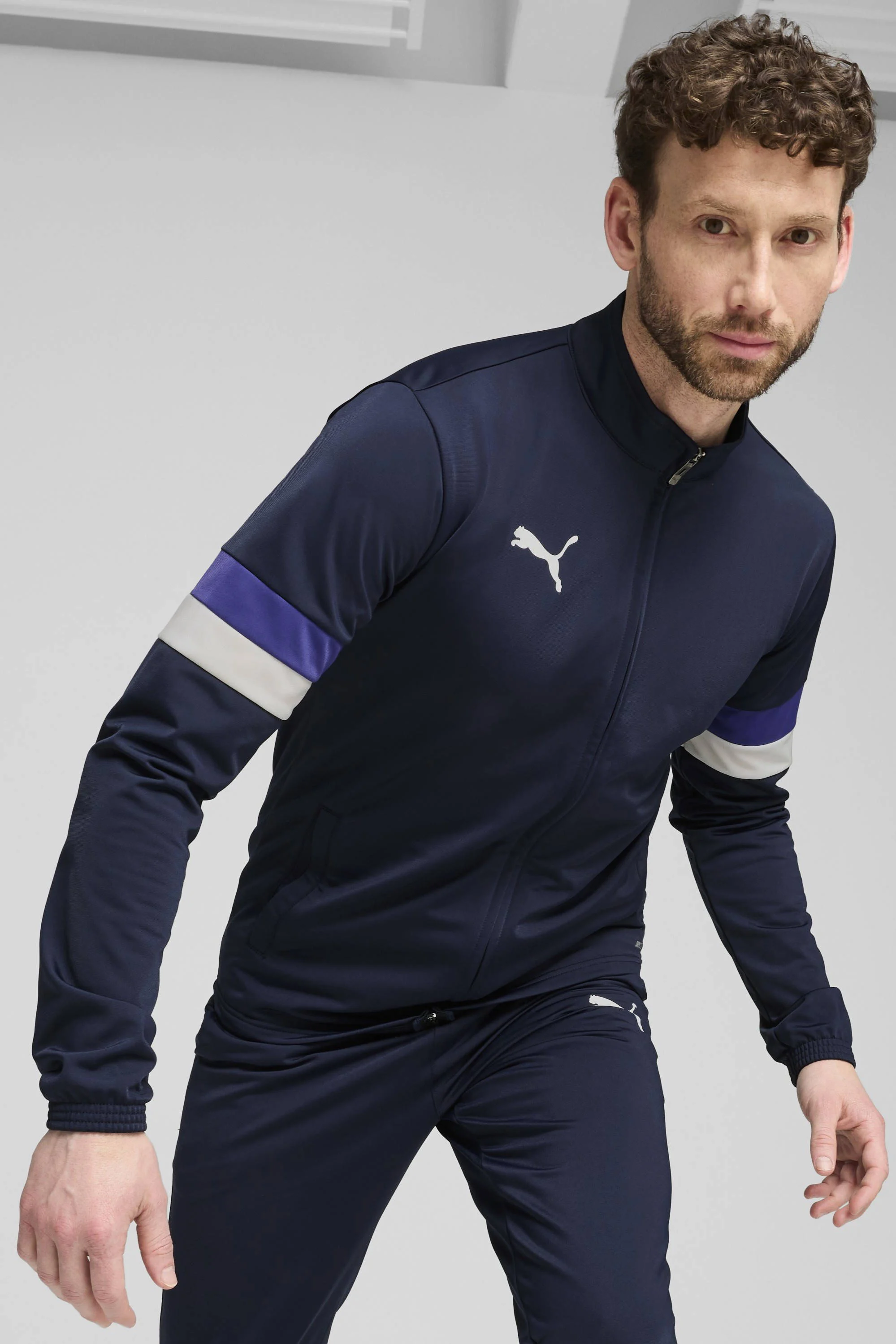 Puma Senior  trainingspak individualRISE donkerblauw/kobaltblauw