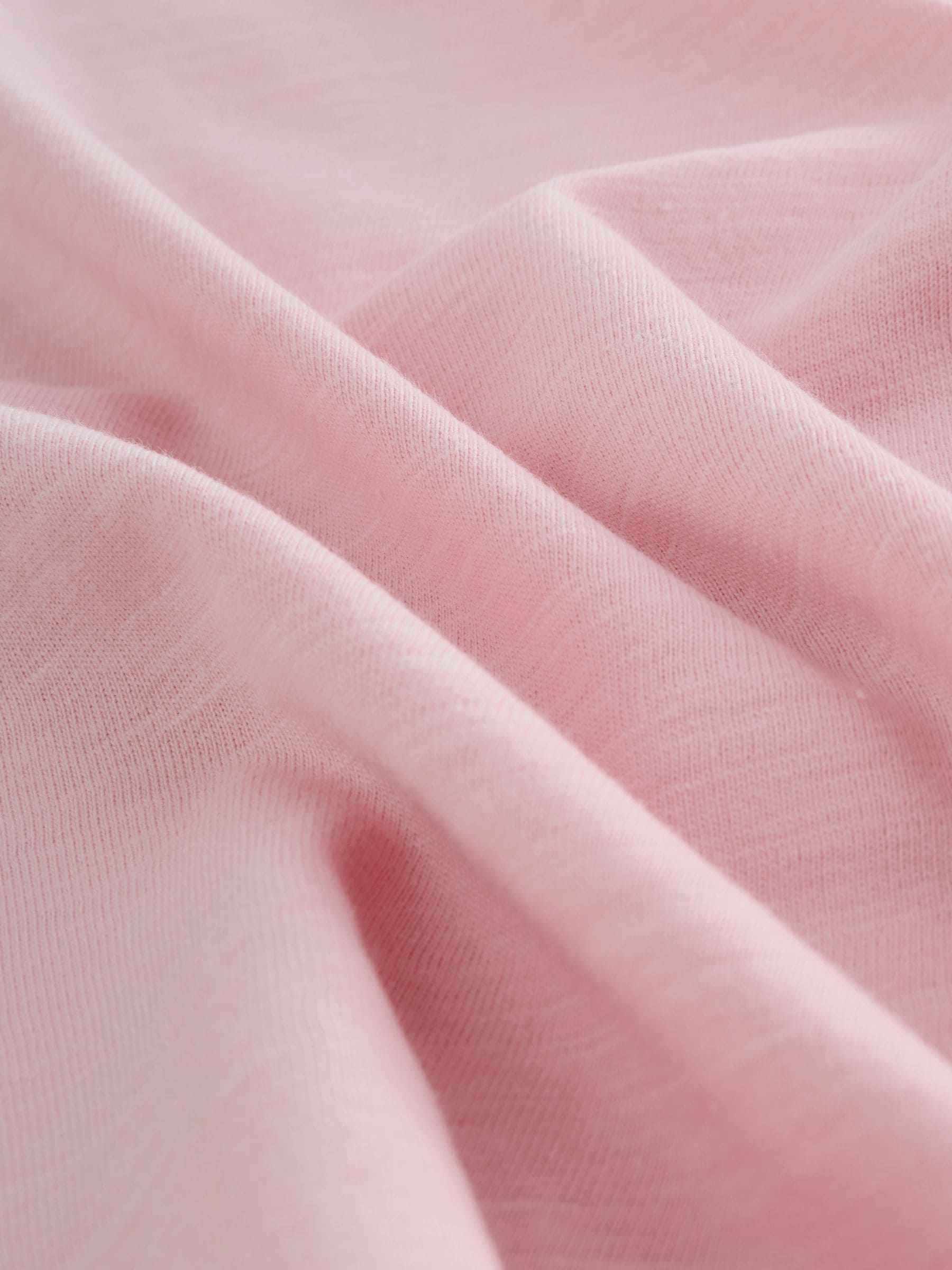 Roze - T-shirt met zakje en madeliefjesprint (1,5-16 jr)