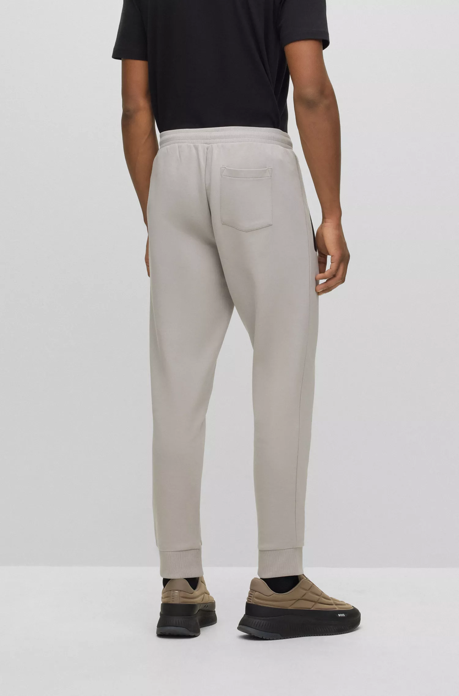 Calça de fato de treino BOSS em mistura de algodão verde com faixa com o logótipo.