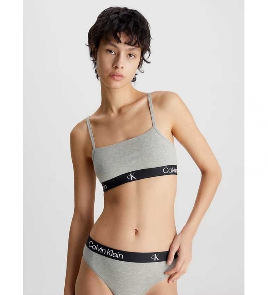 Conjunto de dois sutiãs Calvin Klein, modelo 1996, cinza e preto.