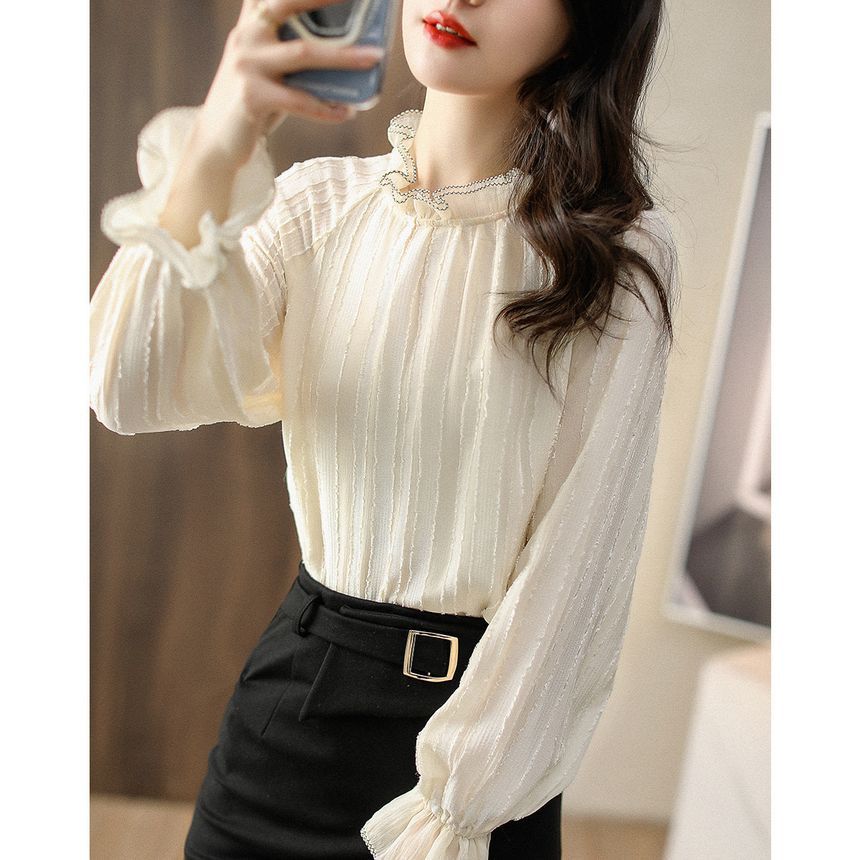 Jeonseon - Blouse met pofmouwen en hoge hals, geplooide kant en franjes