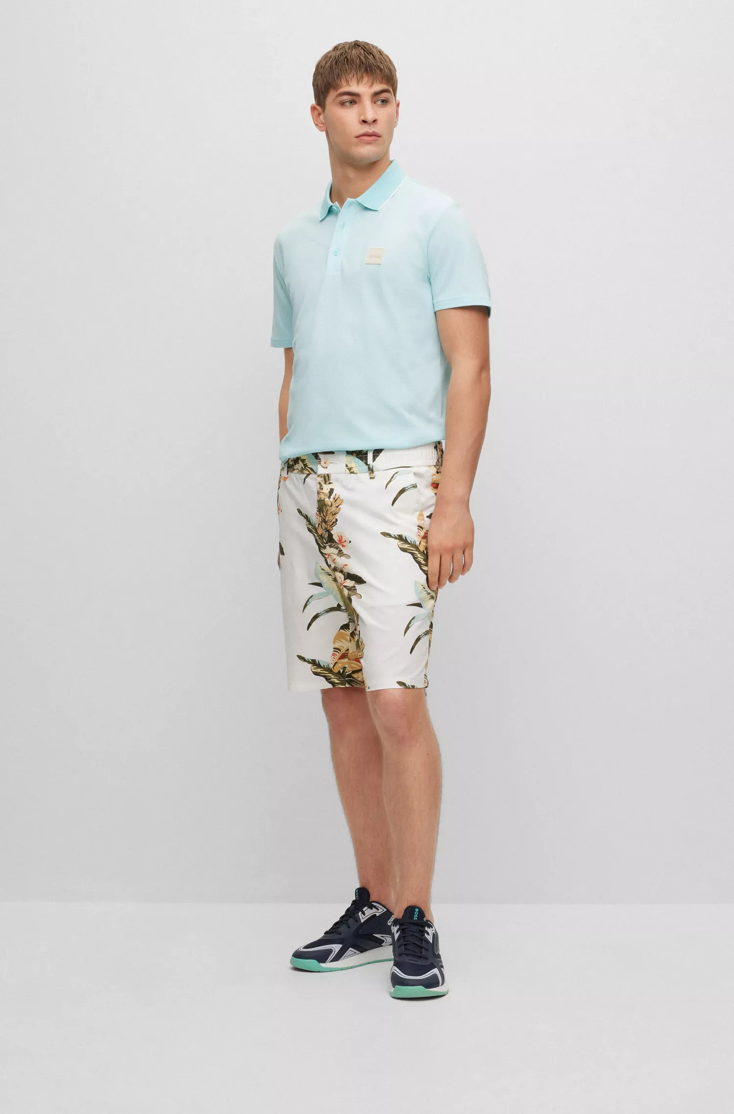 Camisa polo BOSS laranja em algodão Oxford com emblema da marca.