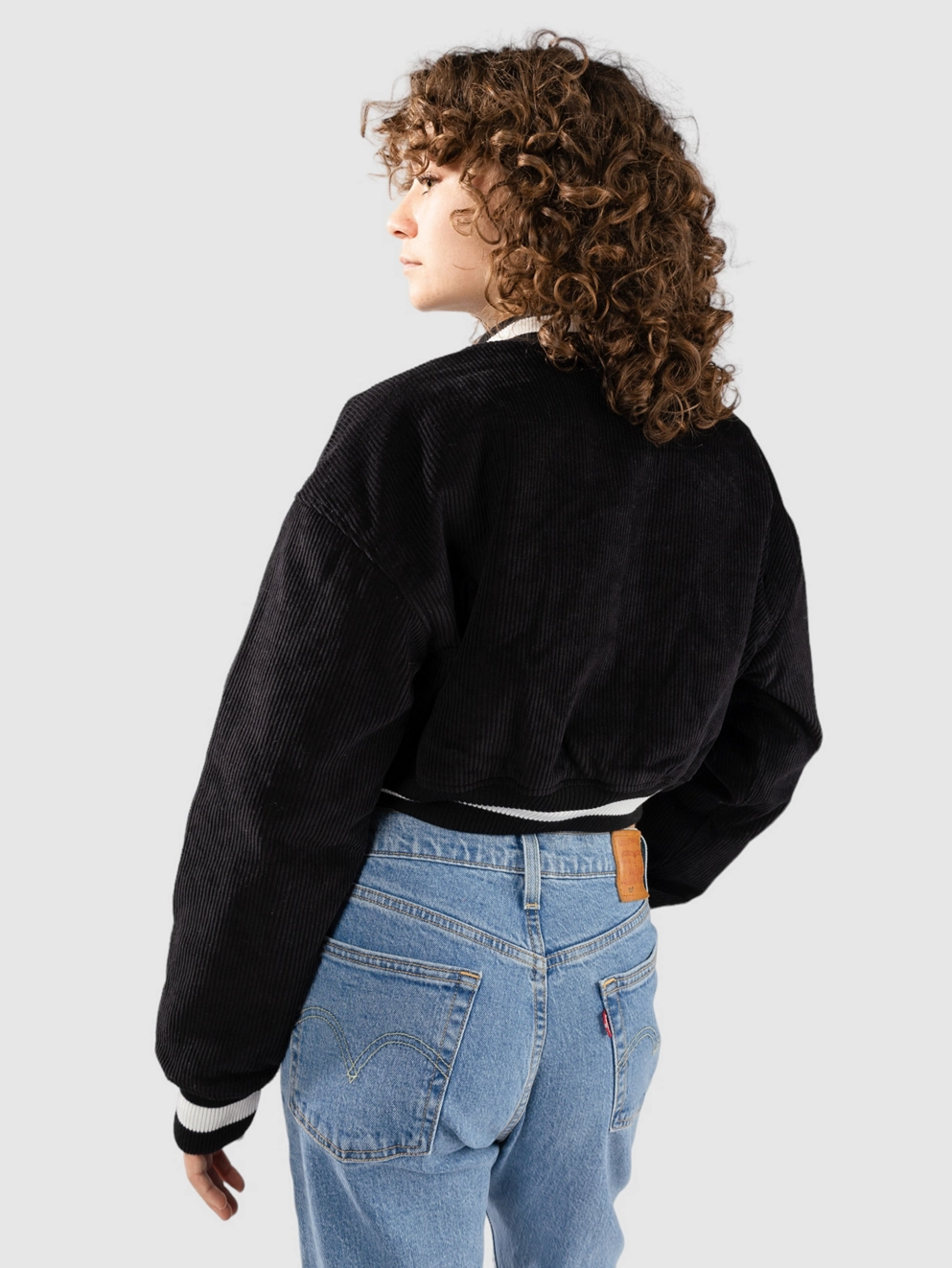 Petals and Peacocks Billie Crop Varsity Jacket black