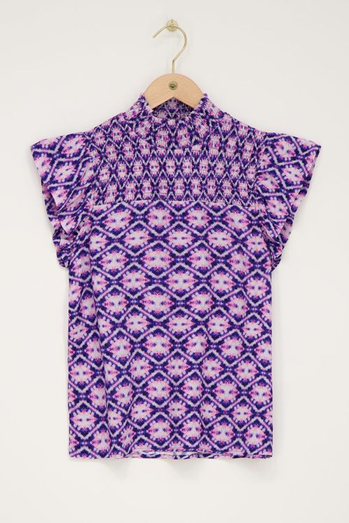 Blauwe top met roze print en smock