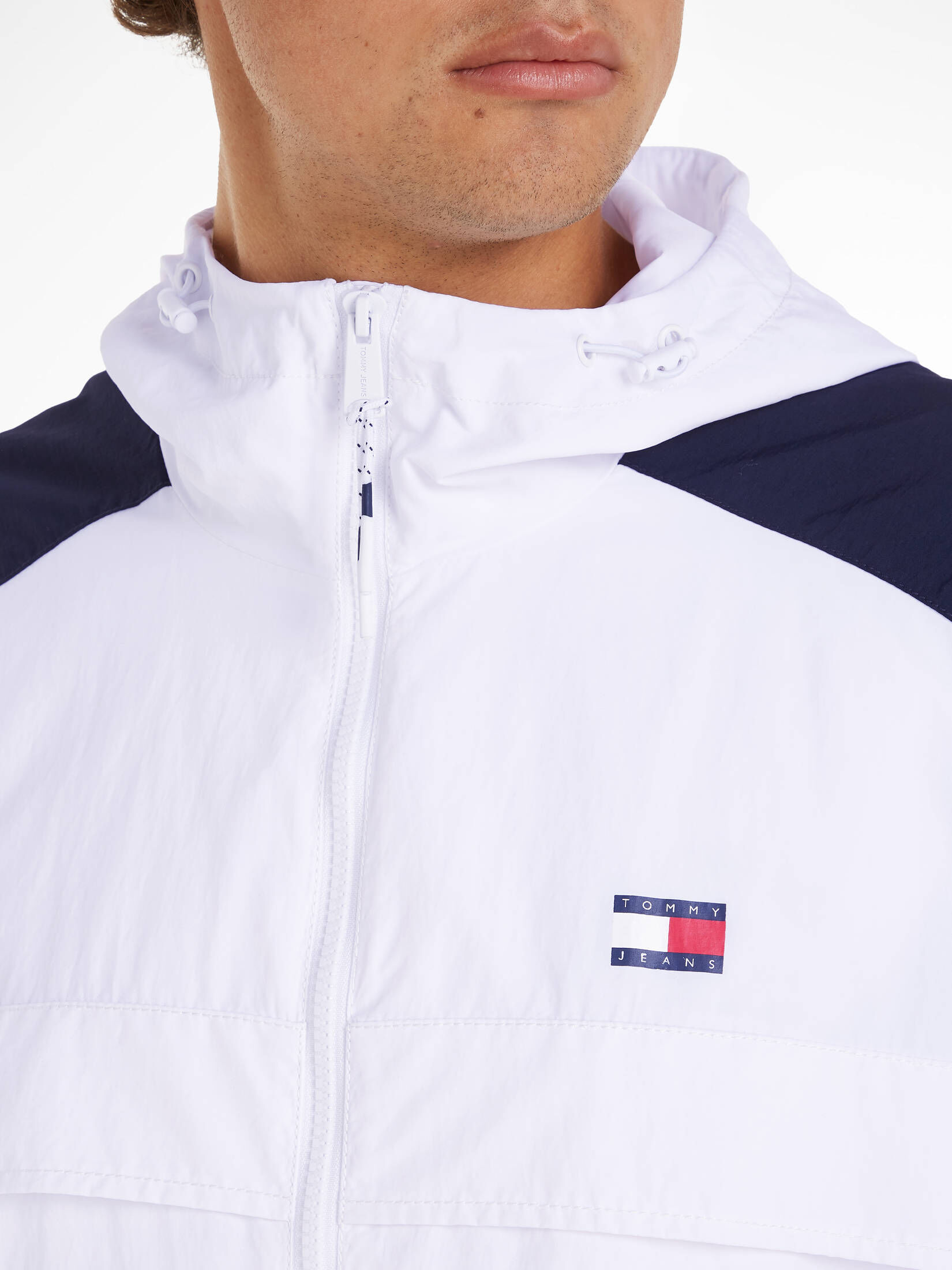 Tommy Jeans| Herren Kapuzenjacke TJM CHICAGO CLBK WINDBREAKER
