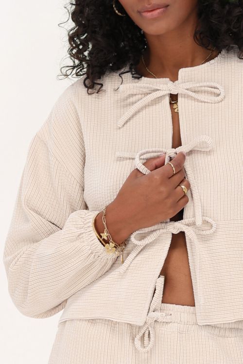 Beige corduroy top met strikjes