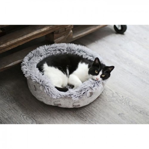 Cama redonda AIME em couro bege para animais de estimação de pequeno porte.
