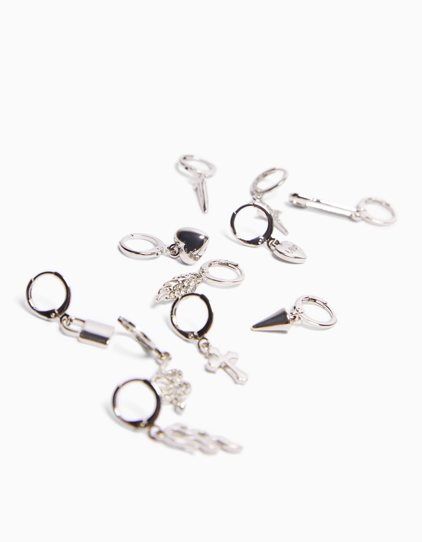 Conjunto de 11 brincos de pressão com detalhes de cobra, cruz e espinhos.