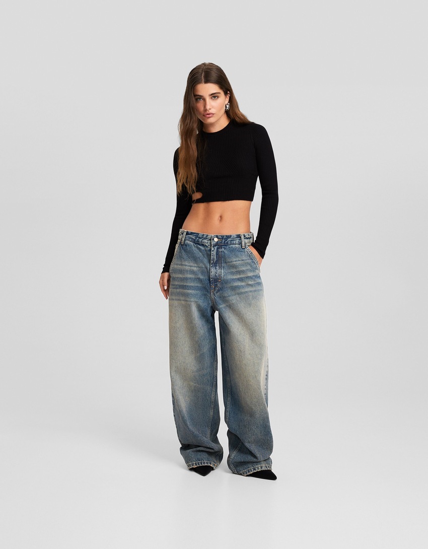 calça jeans estilo skater com efeito desbotado