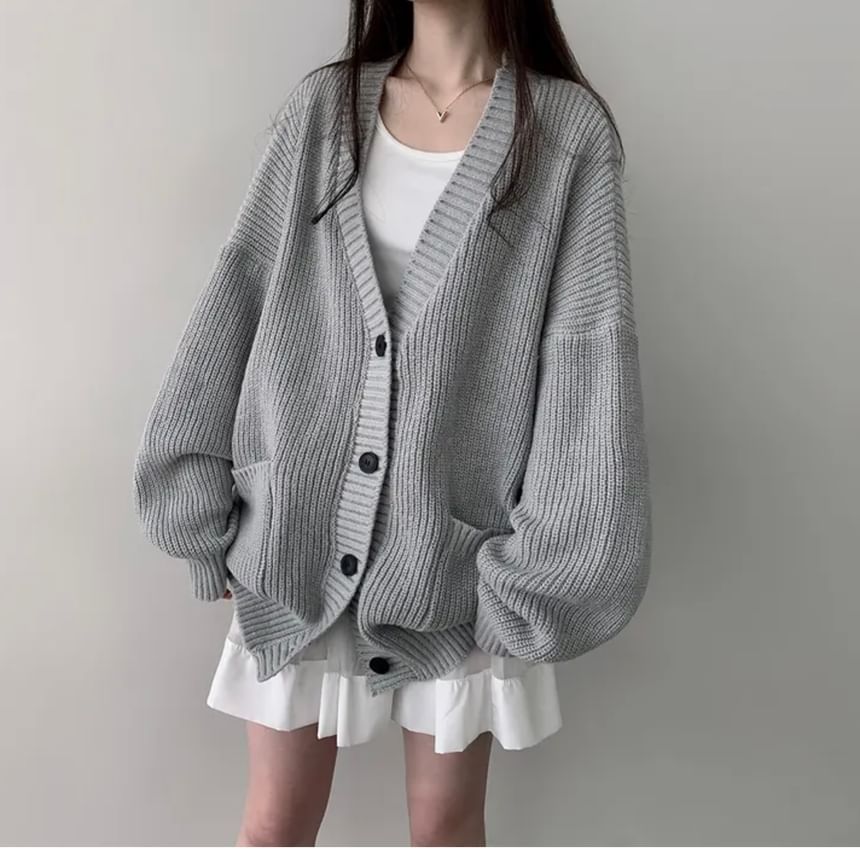 Coris - Oversized vest met pofmouwen, V-hals en effen zakdetail