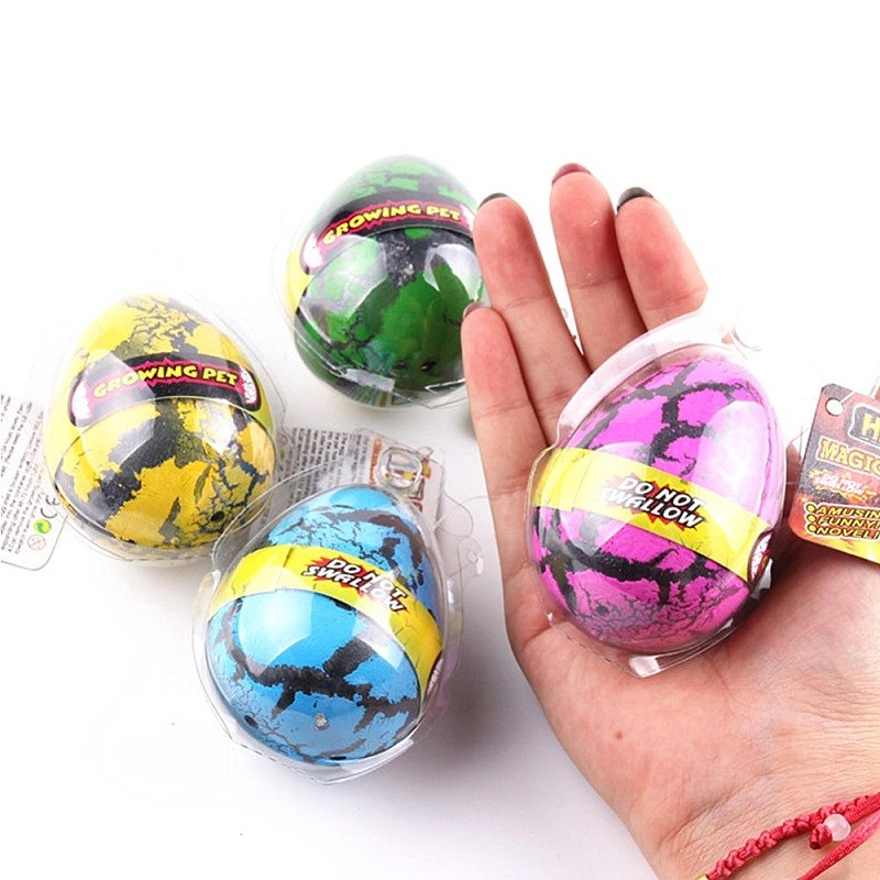 (40x60mm) Schlüpfendes Dinosaurier Ei Kinder Wasser Spielzeug Dino - Assortiert