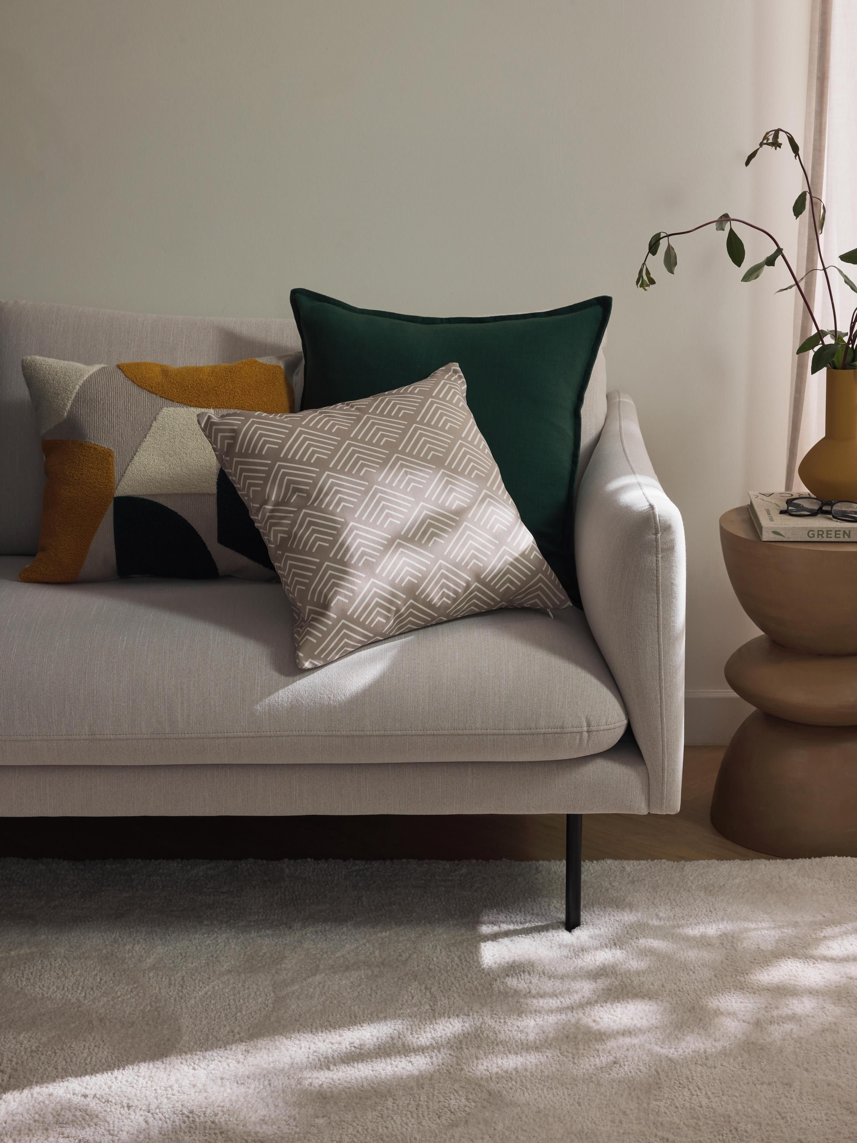 Katoenen kussenhoes Nomi met abstracte decoratie